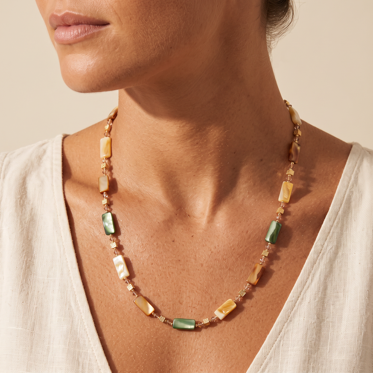 Armour necklace worn short at the collarbone