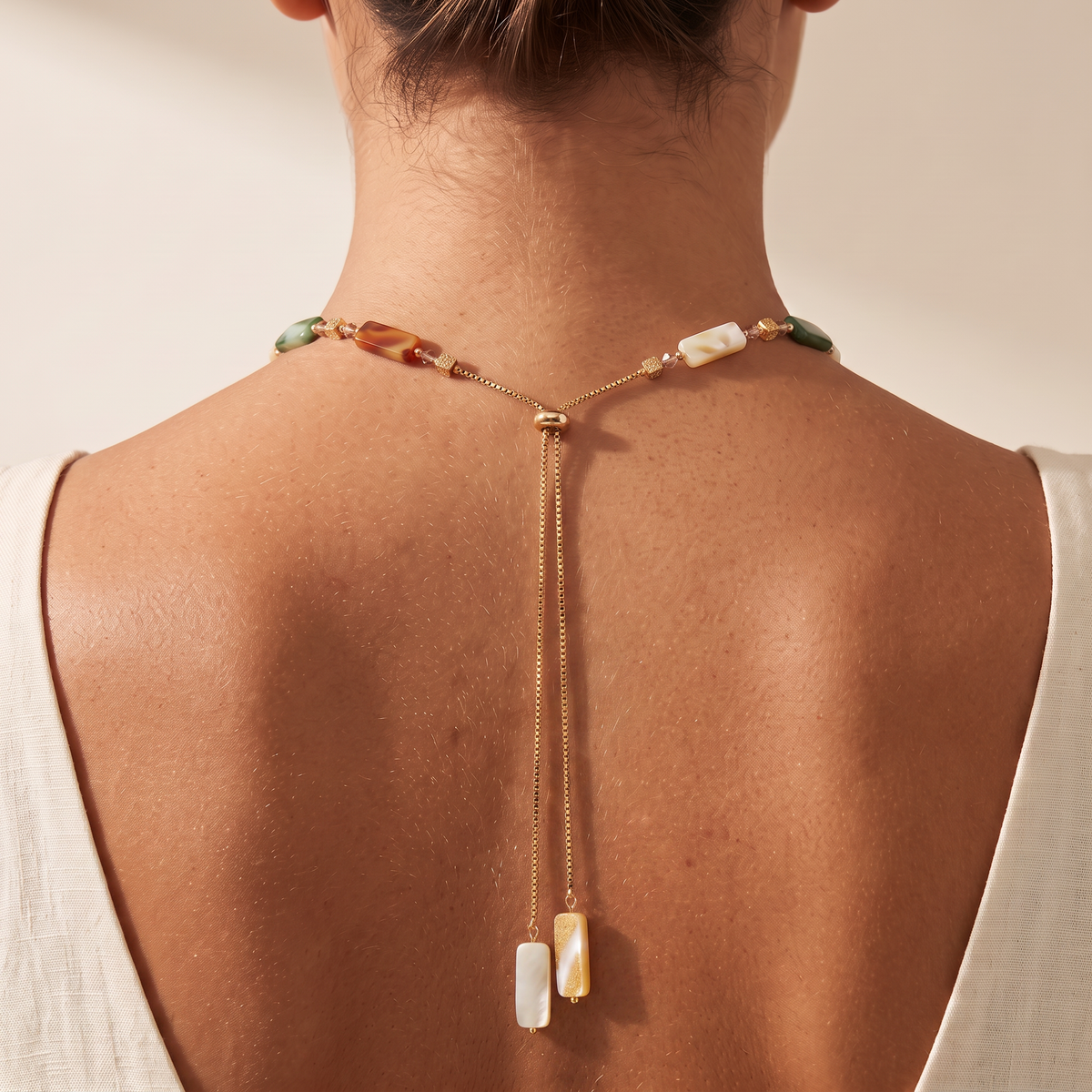 Armour necklace worn with the bolo drop down the back