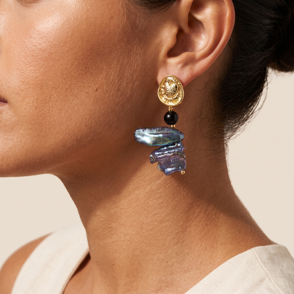 Deepwater Pearl earring worn, close on the ear