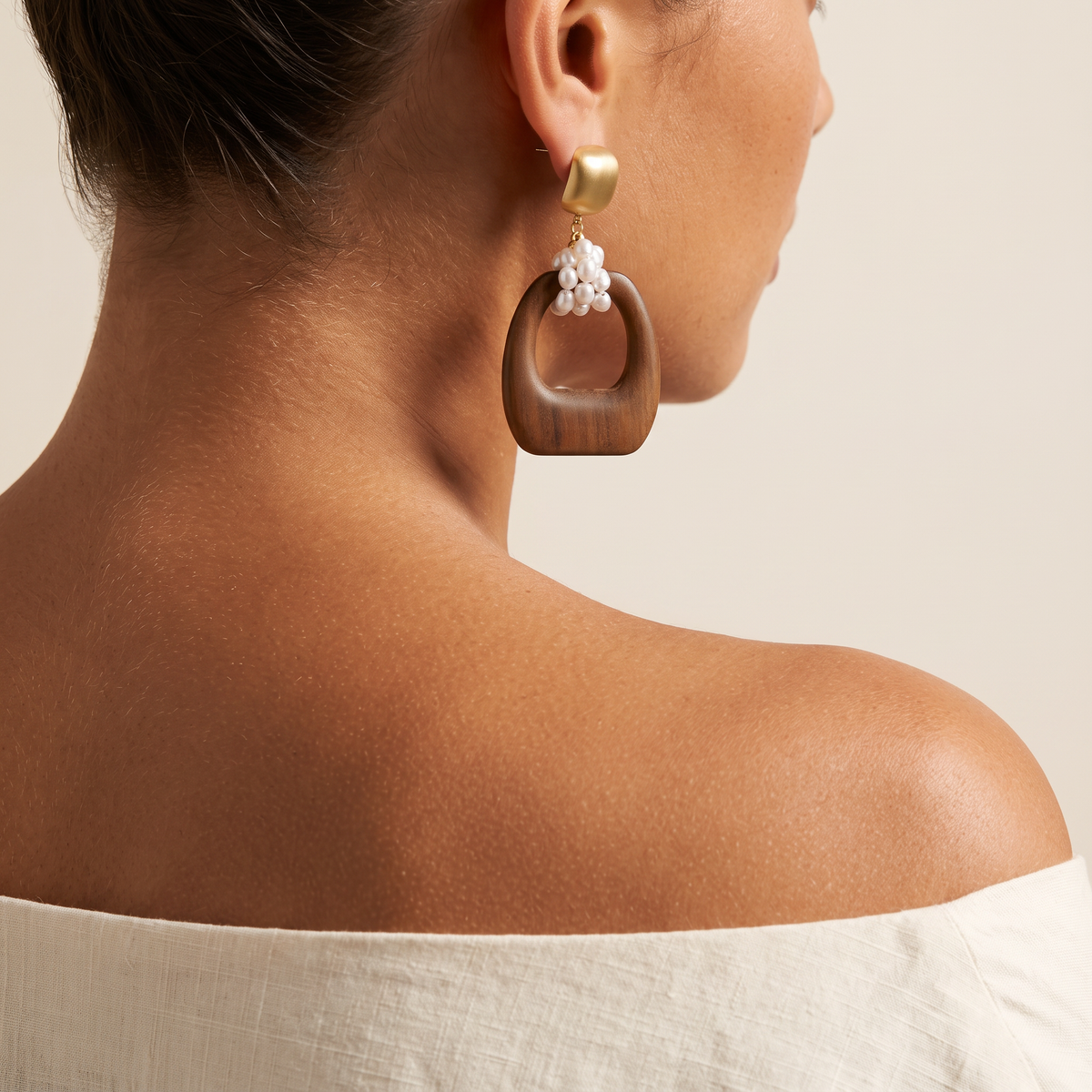 Heartwood earring worn, seen over the shoulder