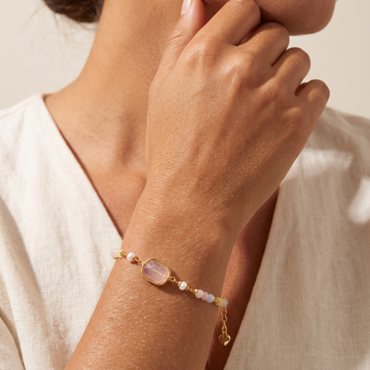 Still Water bracelet worn, hand raised