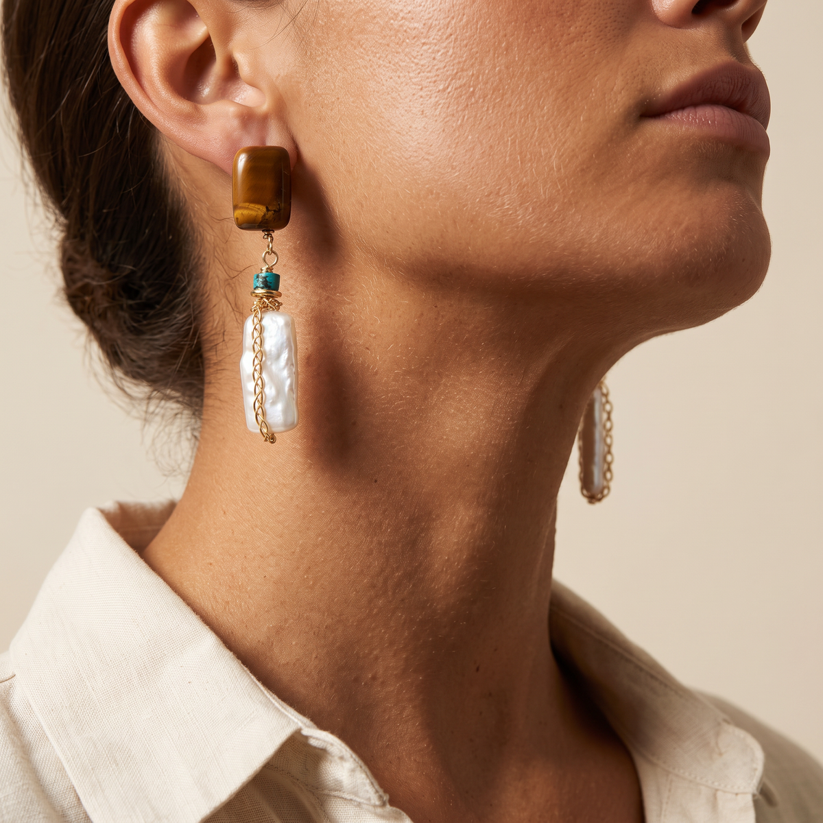 Amber Hour earring worn, shown against the jaw