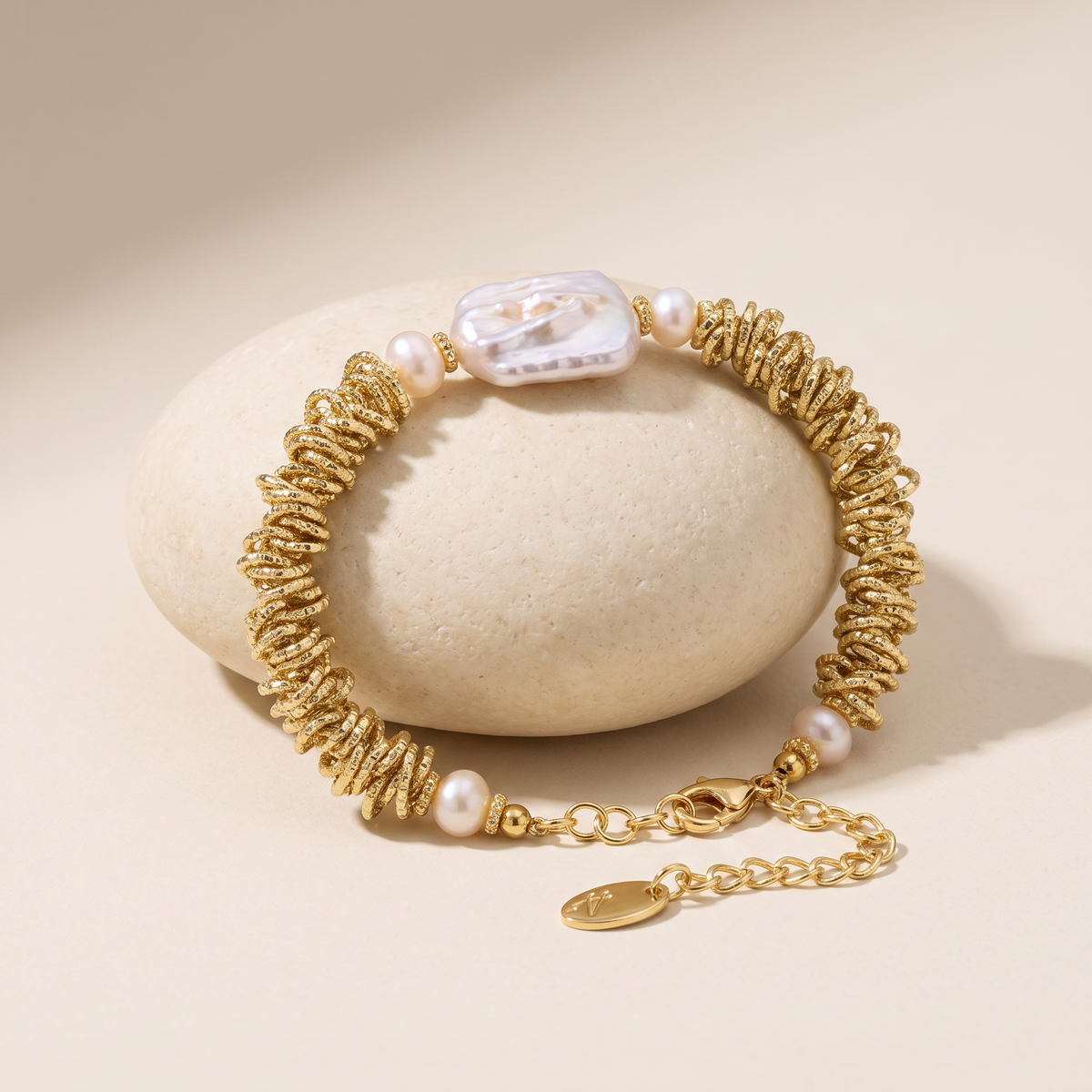 Deep Current bracelet resting on a pale stone