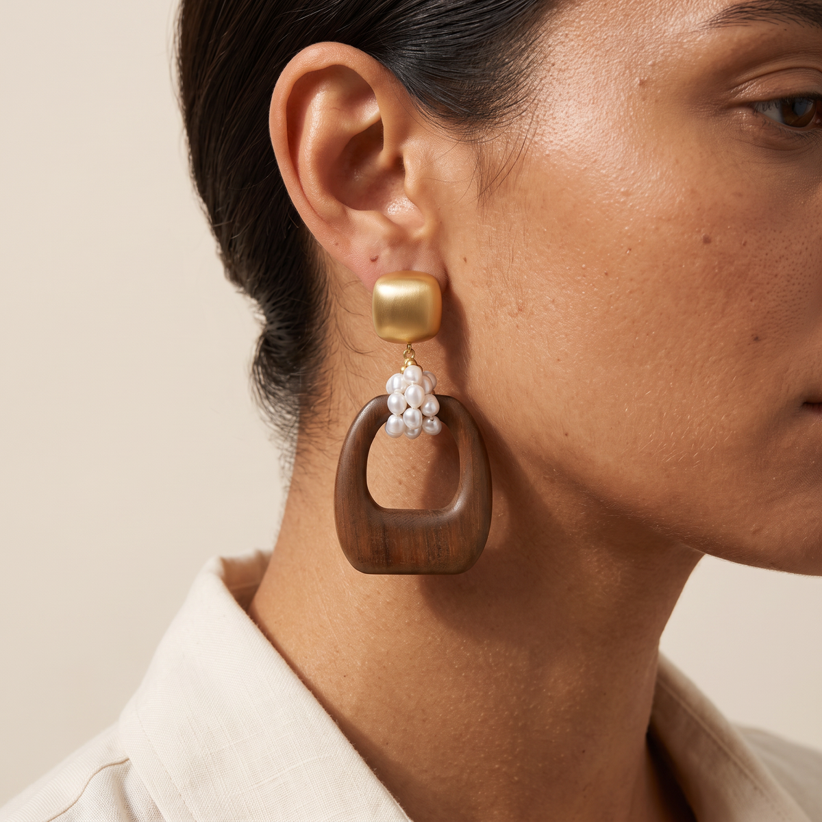 Heartwood earring worn, close on the ear