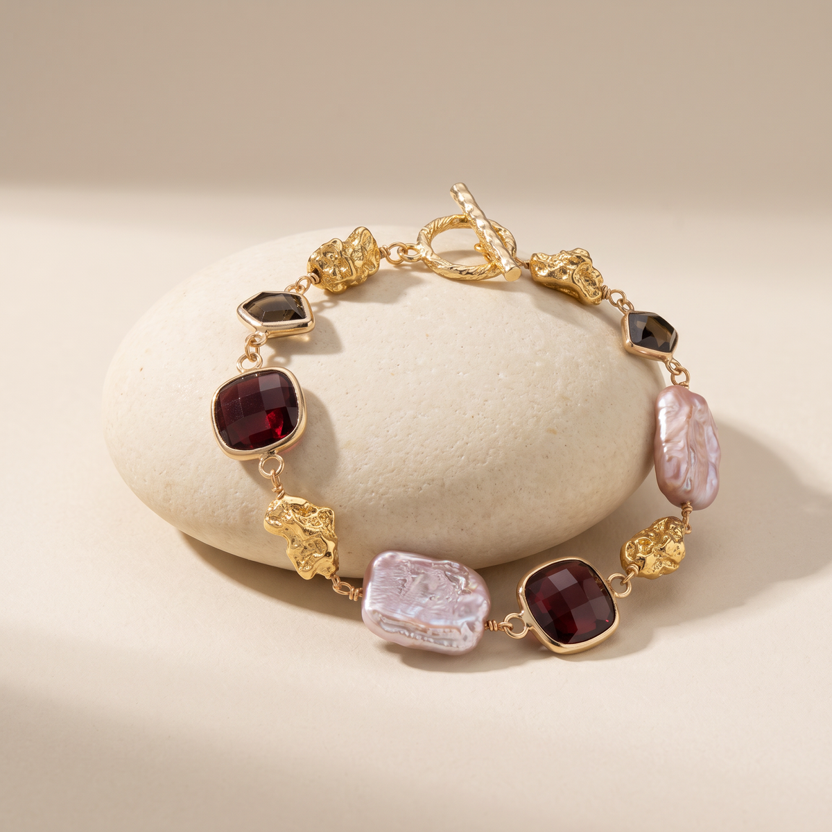 Midnight bracelet resting on a pale stone
