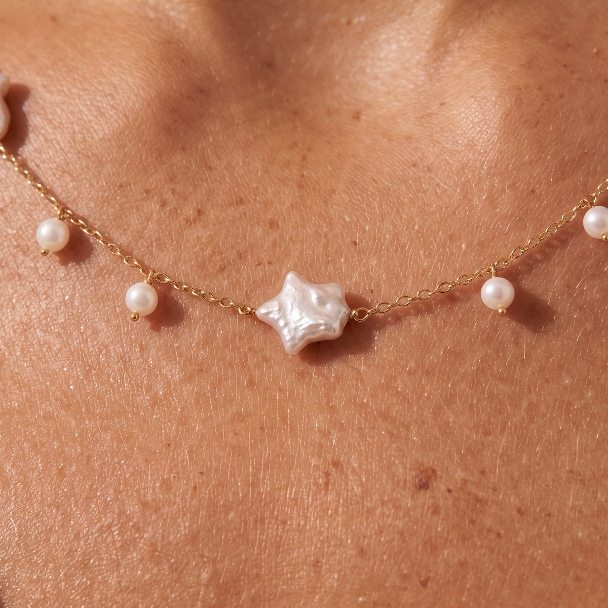 Night Passage necklace worn, close on the star pearl