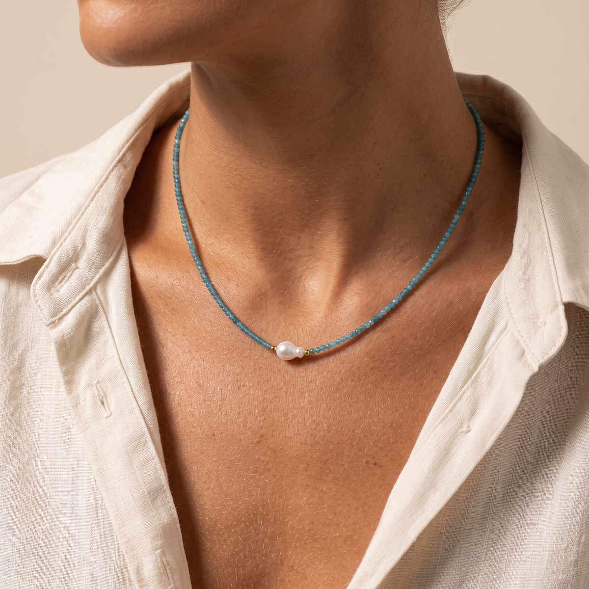 Tidewater necklace worn with an open collar